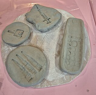 Making impressions in Warren clay for The Cabinet of (un)Natural History Folkestone Fringe by Rosalie Morris
