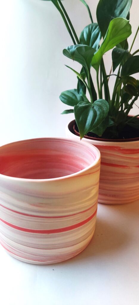 Sandgate ceramics portfolio raspberry ripple pot: red and white Parian pot thrown