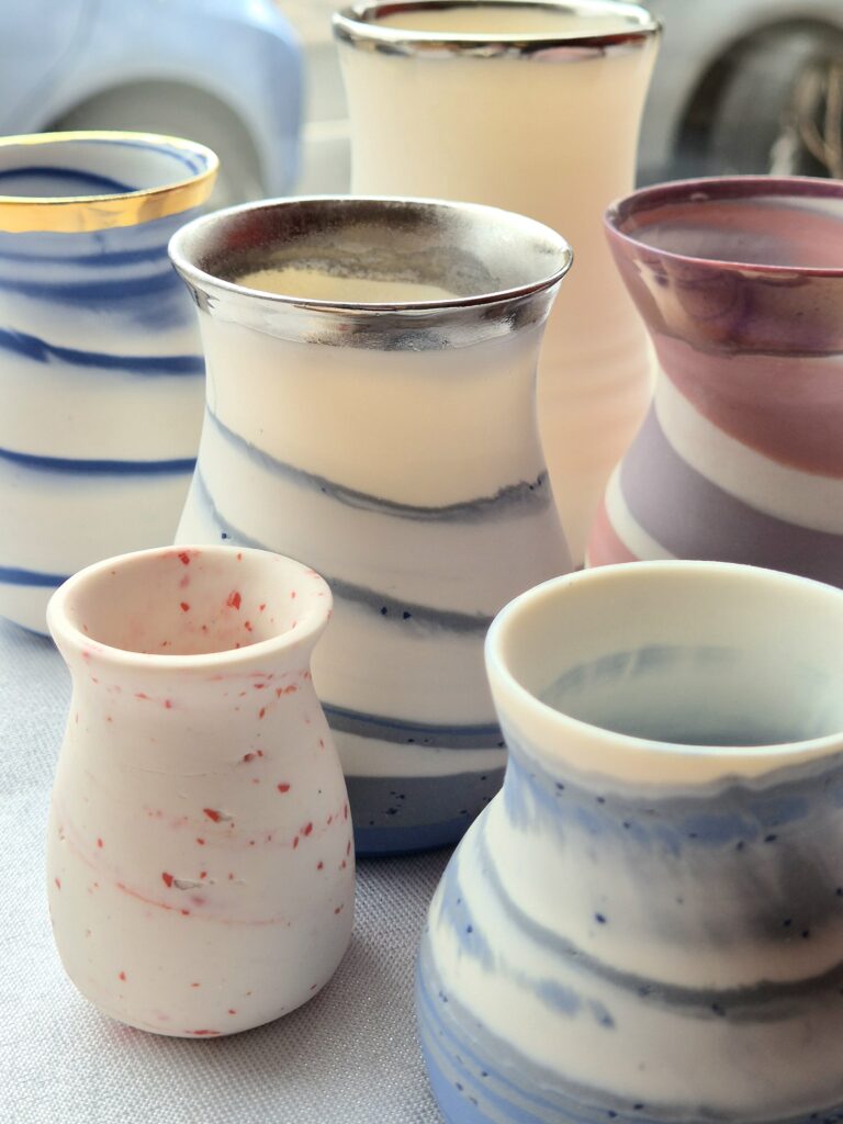 Bud vases by Sandgate Ceramic made with mixed coloured porcelain and parian clay. 